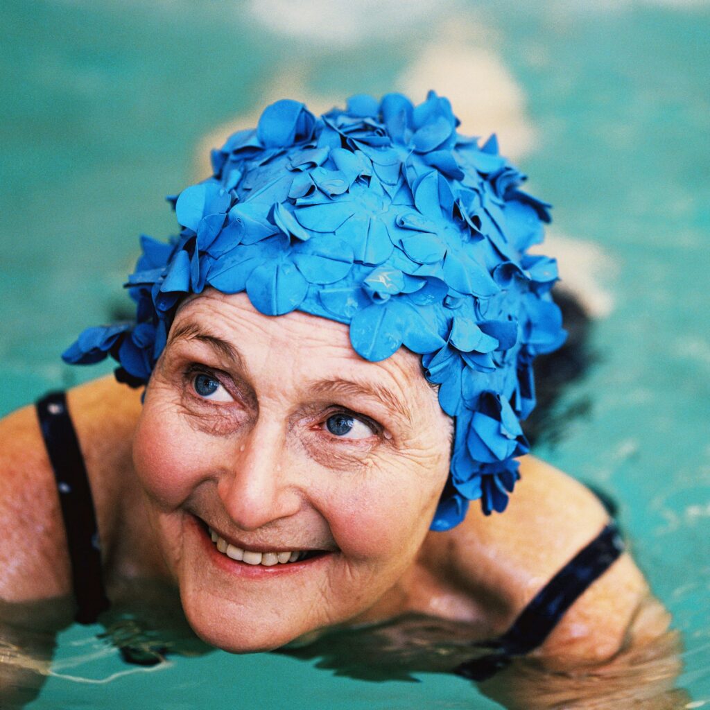 woman in pool with cap